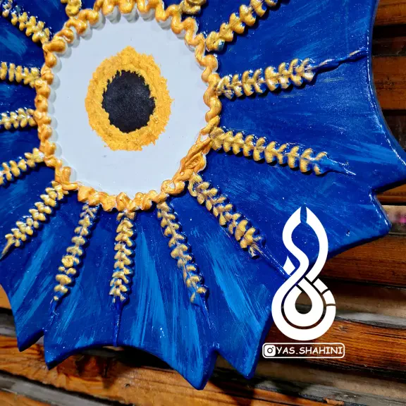 تصویر 1  دیوارکوب سفالی چشم زخم طرح 7